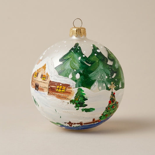 Palla di Natale Ø 10 cm dipinta a mano: baita di legno e abeti innevati