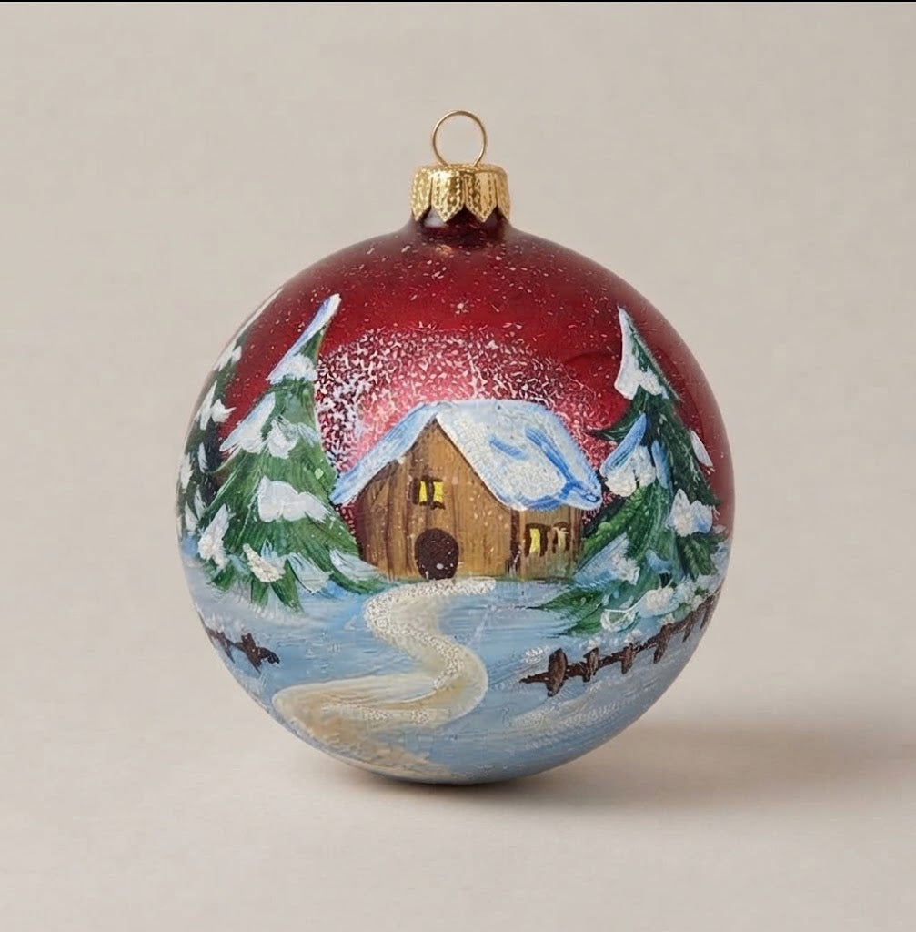 Hand-painted 4 in (10 cm) Christmas ornament: snowy cabin and path on red