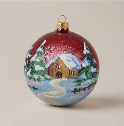 Hand-painted 4 in (10 cm) Christmas ornament: snowy cabin and path on red
