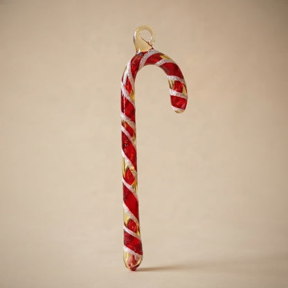 Christmas candy cane in hand-decorated glass
