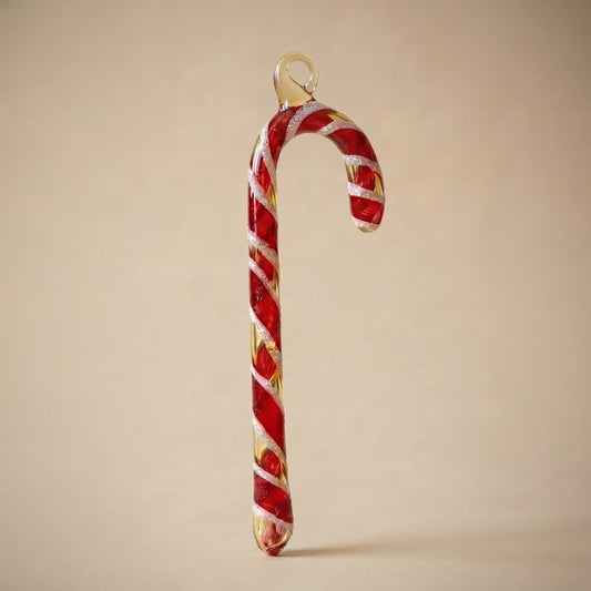 Christmas candy cane in hand-decorated glass