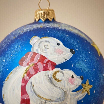 Brush-painted decoration detail: polar bears with scarves on blue