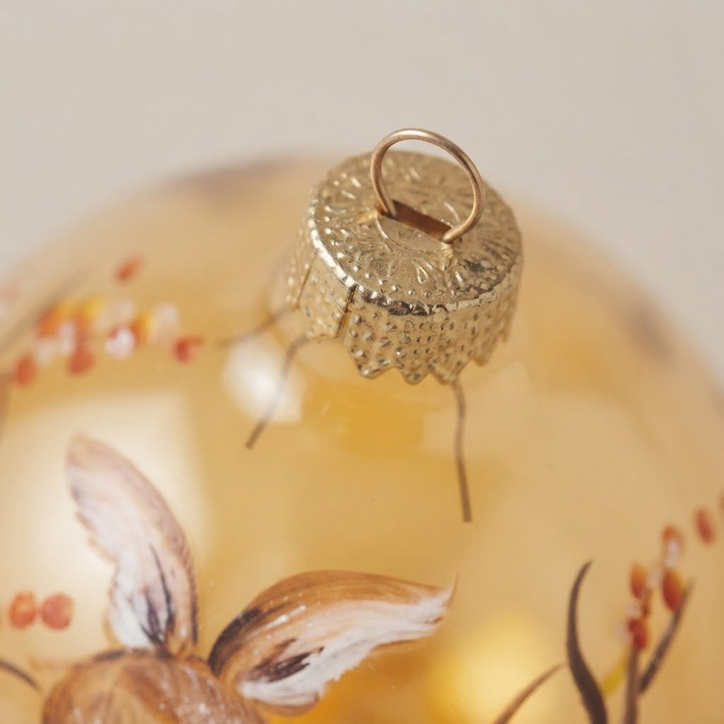 Lato e retro della palla di Natale in vetro soffiato
