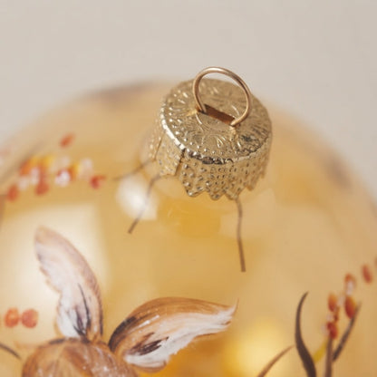 Lato e retro della palla di Natale in vetro soffiato
