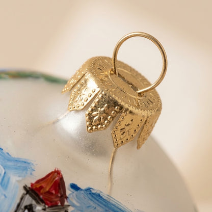 Lato e retro della palla di Natale in vetro soffiato