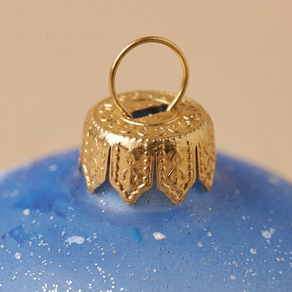 Lato e retro della palla di Natale in vetro soffiato