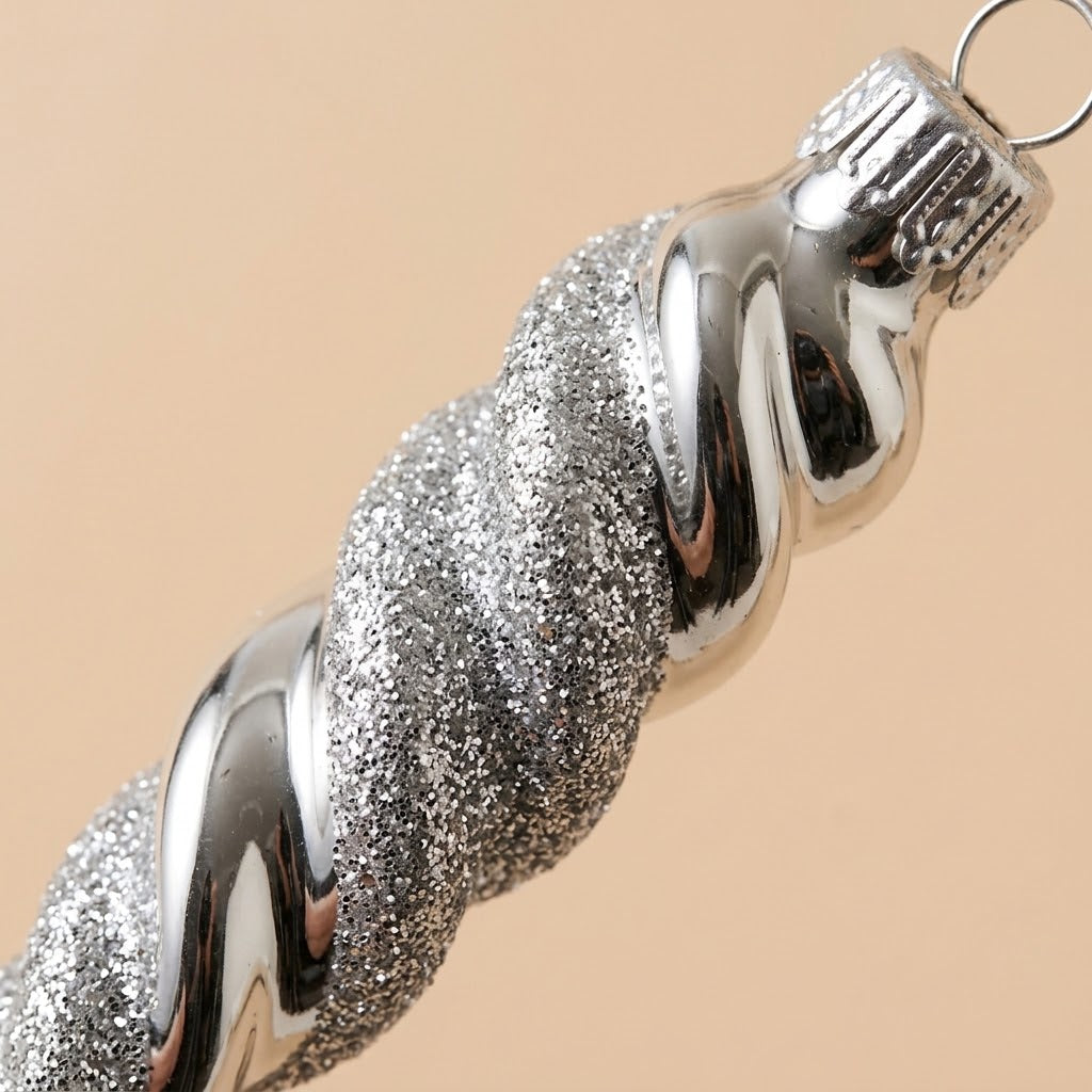 Detail of the silver and glitter spiral and silver-tone cap of the icicle