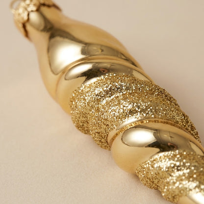 Detail of the glossy gold and gold glitter spiral on the mouth-blown glass icicle