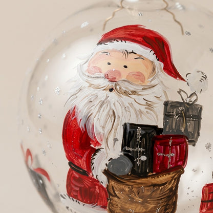 Dettaglio del decoro dipinto a pennello: Babbo Natale con il sacco dei regali su vetro trasparente
