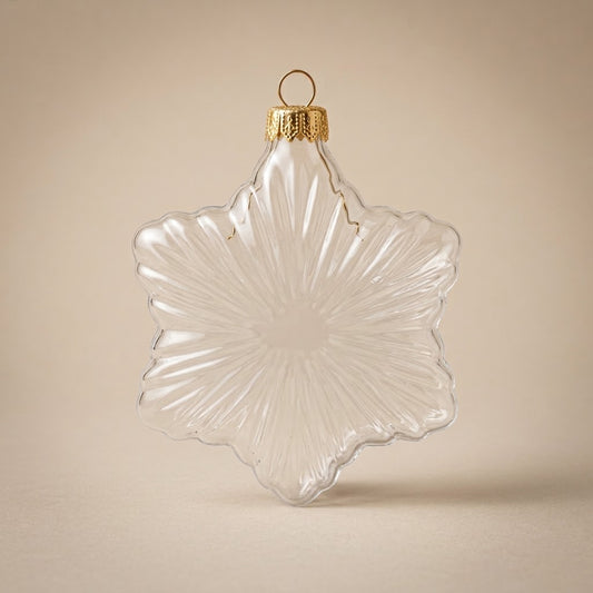Six-pointed clear glass star ornament with gold cap