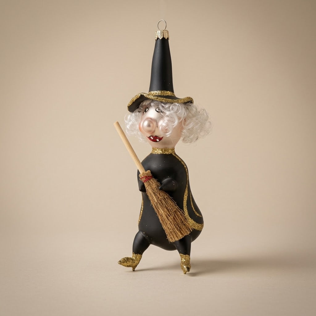 Black and gold glass witch Halloween ornament with straw broom