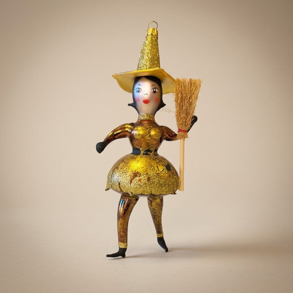 Gold glass witch Halloween ornament with straw broom