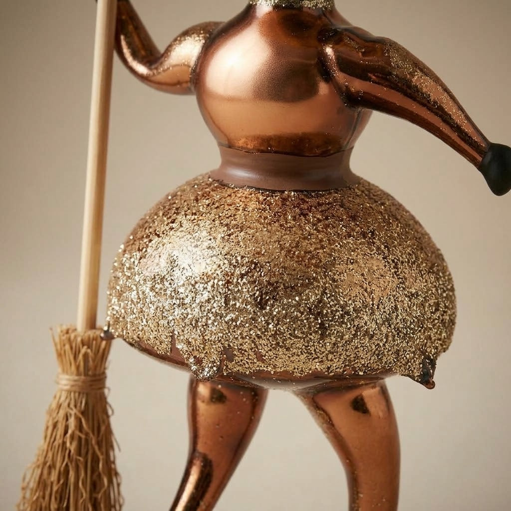 Close-up of the glitter skirt and straw broom